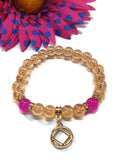 Peach Iridescent Bracelet With Gold Tone Accents - NA